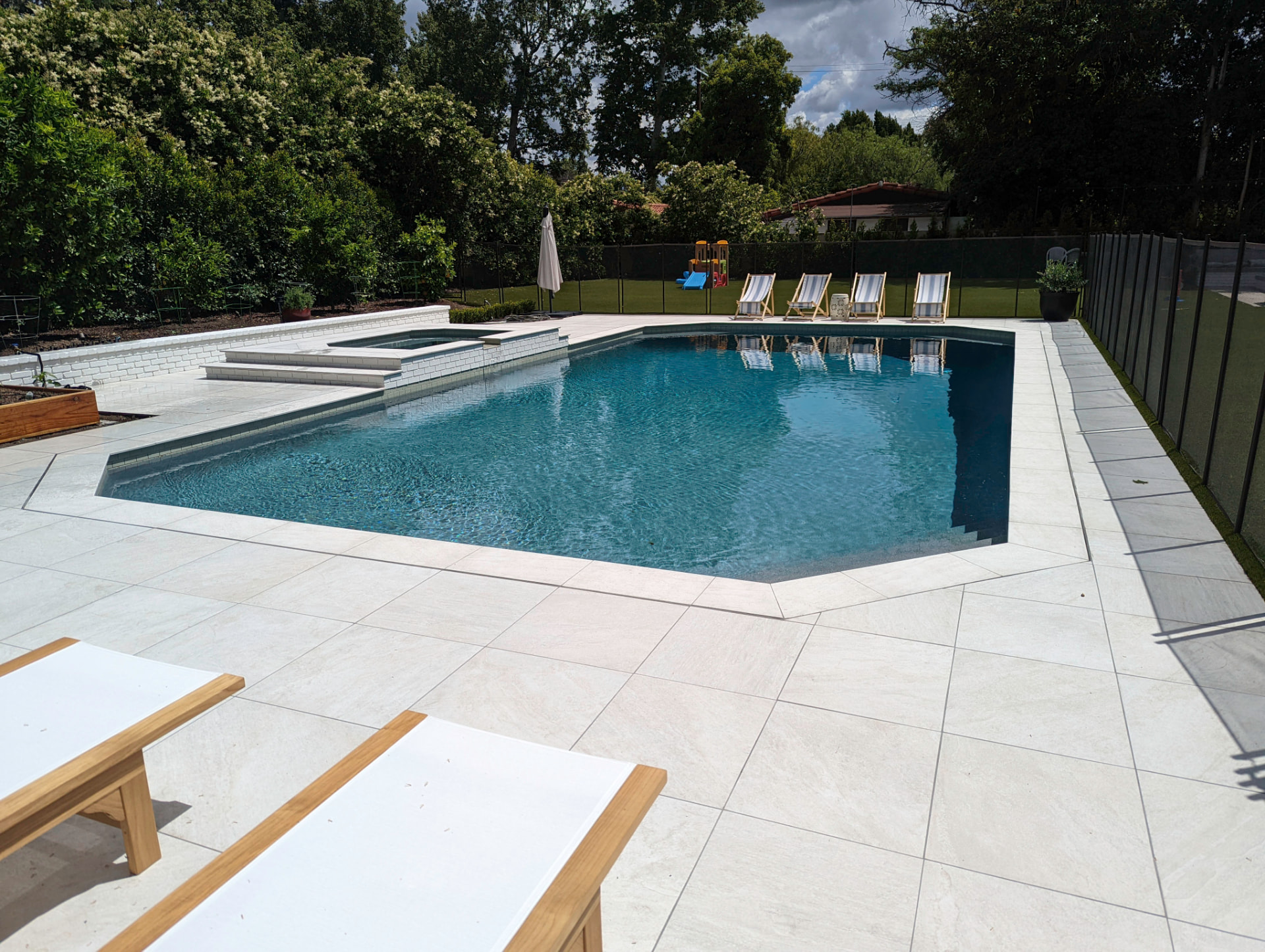 Pool + Spa Retreat custom pool by Platinum Waterscapes